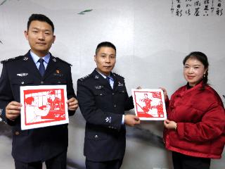 警嫂巧手剪纸“画像” 温暖警营传递深情